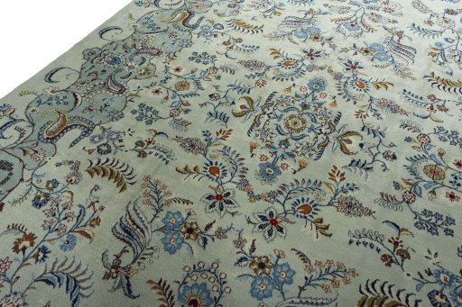 Backside of handmade 2000s Kashan rug showing knot structure and weave density