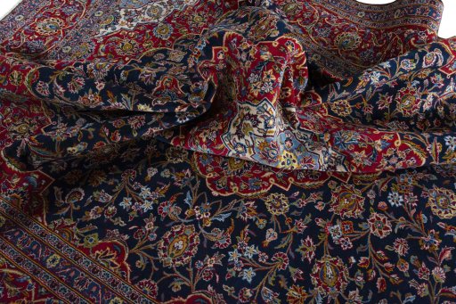 Surface texture of 2000s Kashan rug with natural Wool and intricate pattern
