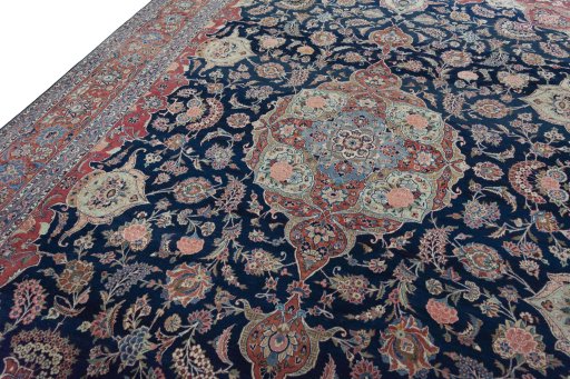 Backside of handmade 1930s Kashan rug showing knot structure and weave density