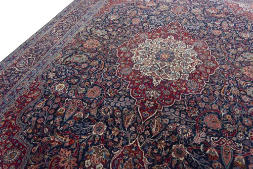 Backside of handmade 1930s Kashan rug showing knot structure and weave density