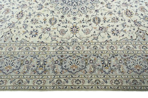 Corner detail of 2000s Kashan rug showing border pattern and Wool pile