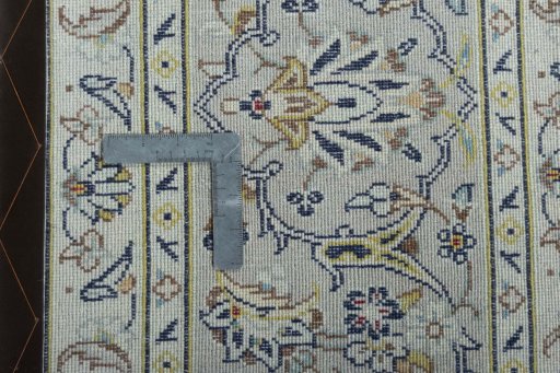 Backside of handmade 2000s Kashan rug showing knot structure and weave density