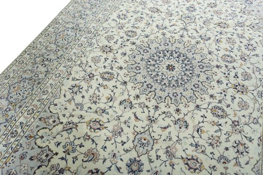 Backside of handmade 2000s Kashan rug showing knot structure and weave density