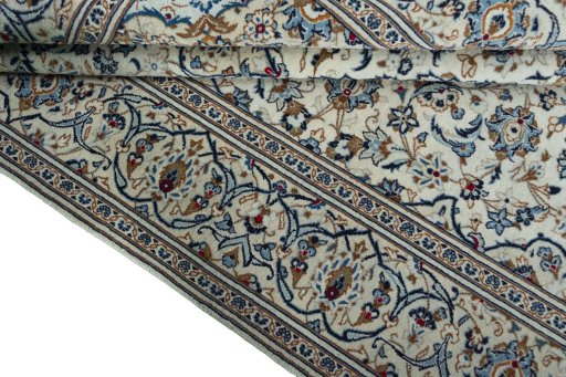 Close-up detail of 2000s Kashan rug from Iran / Persia showing Wool weave