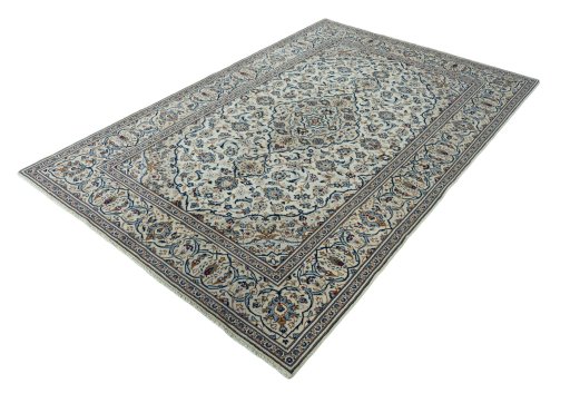 Corner detail of 2000s Kashan rug showing border pattern and Wool pile
