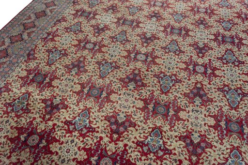 Backside of handmade 1950s Kashan rug showing knot structure and weave density