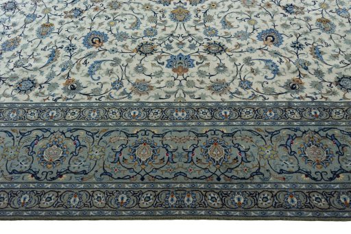 Corner detail of 2000s Kashan rug showing border pattern and Wool pile