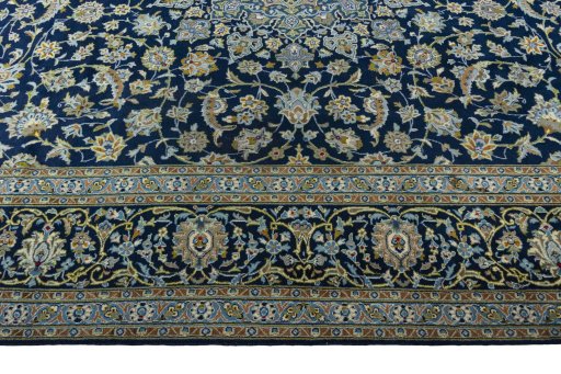 Corner detail of 2000s Kashan rug showing border pattern and Wool pile