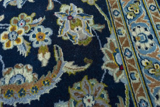 Close-up detail of 2000s Kashan rug from Iran / Persia showing Wool weave