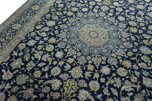 Backside of handmade 2000s Kashan rug showing knot structure and weave density