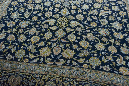 Close-up detail of 2000s Kashan rug from Iran / Persia showing Wool weave