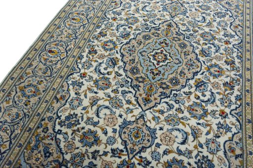 Backside of handmade 2000s Kashan rug showing knot structure and weave density