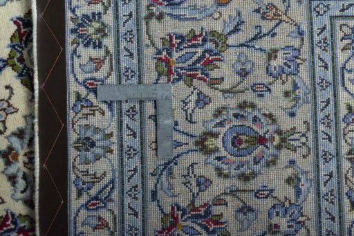 Backside of handmade 2000s Kashan rug showing knot structure and weave density