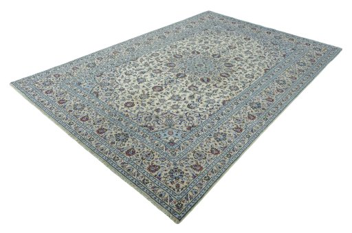 Corner detail of 2000s Kashan rug showing border pattern and Wool pile