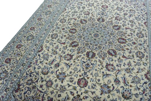 Backside of handmade 2000s Kashan rug showing knot structure and weave density