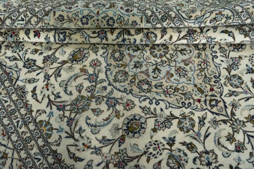 Close-up detail of 2000s Kashan rug from Iran / Persia showing Wool weave