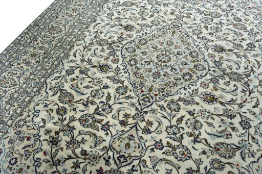 Backside of handmade 2000s Kashan rug showing knot structure and weave density