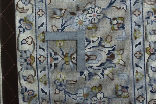 Backside of handmade 2000s Kashan rug showing knot structure and weave density