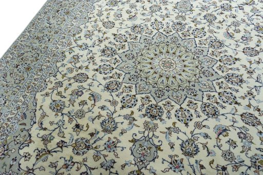 Backside of handmade 2000s Kashan rug showing knot structure and weave density