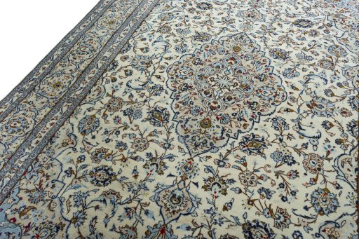 Backside of handmade 2000s Kashan rug showing knot structure and weave density