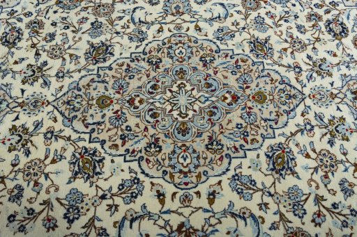 Central medallion detail of 2000s Kashan rug from Iran / Persia