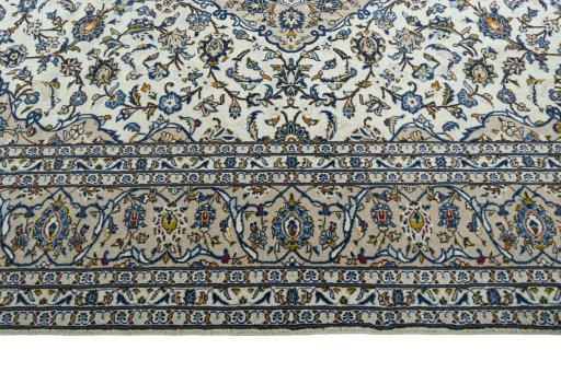 Corner detail of 2000s Kashan rug showing border pattern and Wool pile