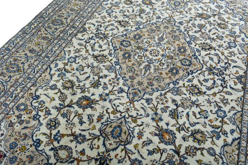 Backside of handmade 2000s Kashan rug showing knot structure and weave density