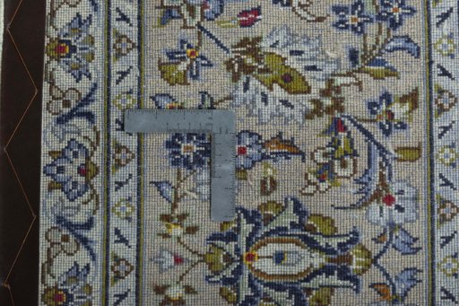 Backside of handmade 2000s Kashan rug showing knot structure and weave density