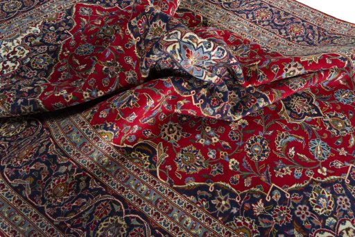 Surface texture of 2000s Kashan rug with natural Wool and intricate pattern