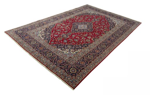 Corner detail of 2000s Kashan rug showing border pattern and Wool pile