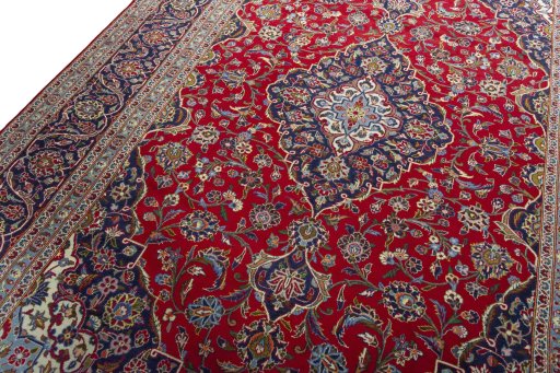 Backside of handmade 2000s Kashan rug showing knot structure and weave density