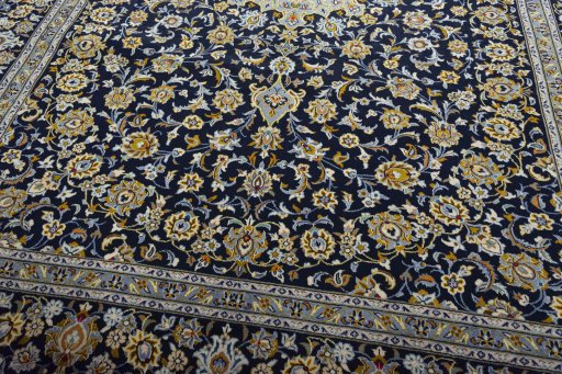Close-up detail of 2000s Kashan rug from Iran / Persia showing Wool weave