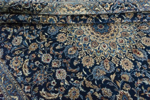 Close-up detail of 2000s Kashan rug from Iran / Persia showing Wool weave