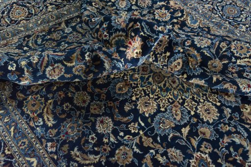 Surface texture of 2000s Kashan rug with natural Wool and intricate pattern