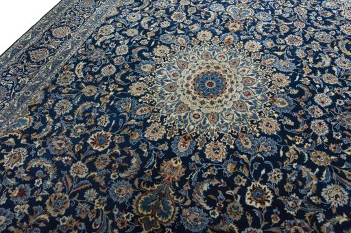 Backside of handmade 2000s Kashan rug showing knot structure and weave density