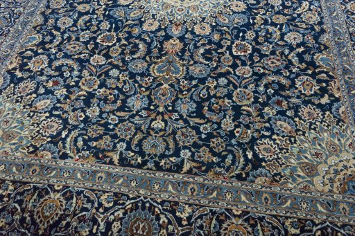 Close-up detail of 2000s Kashan rug from Iran / Persia showing Wool weave