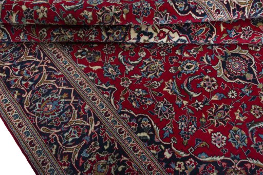 Close-up detail of 2000s Kashan rug from Iran / Persia showing Wool weave