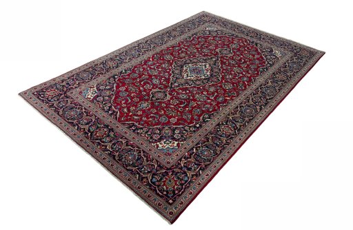Corner detail of 2000s Kashan rug showing border pattern and Wool pile