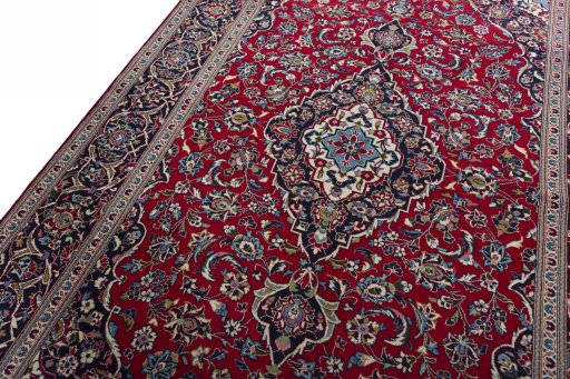 Backside of handmade 2000s Kashan rug showing knot structure and weave density