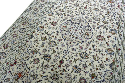 Backside of handmade 2000s Kashan rug showing knot structure and weave density