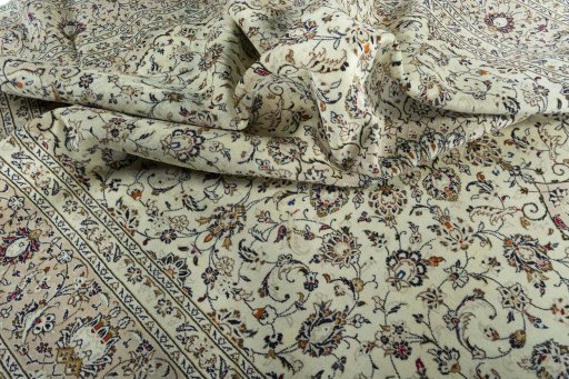 Surface texture of 2000s Kashan rug with natural Wool and intricate pattern