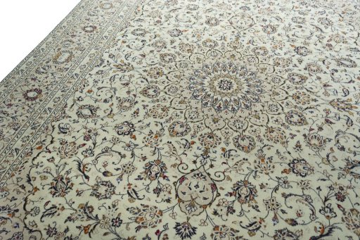 Backside of handmade 2000s Kashan rug showing knot structure and weave density
