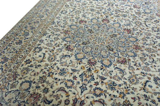 Backside of handmade 2000s Kashan rug showing knot structure and weave density