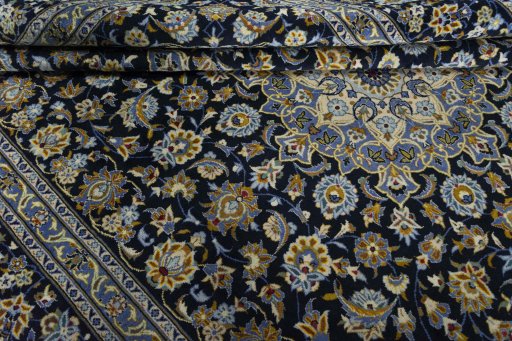 Close-up detail of 2000s Kashan rug from Iran / Persia showing Wool weave