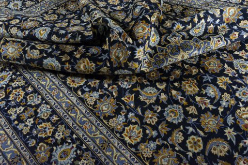 Surface texture of 2000s Kashan rug with natural Wool and intricate pattern
