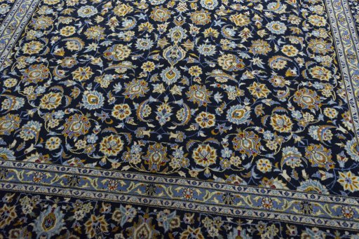 Close-up detail of 2000s Kashan rug from Iran / Persia showing Wool weave