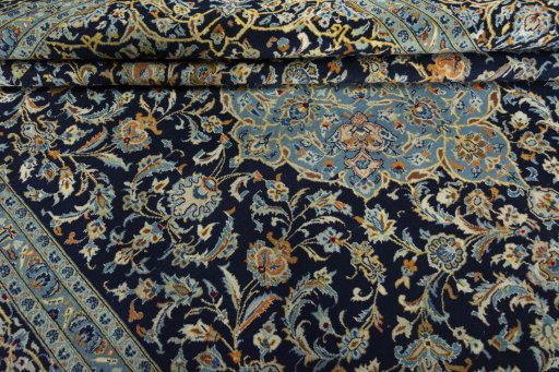 Close-up detail of 2000s Kashan rug from Iran / Persia showing Wool weave
