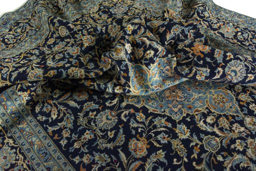 Surface texture of 2000s Kashan rug with natural Wool and intricate pattern