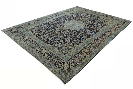 Corner detail of 2000s Kashan rug showing border pattern and Wool pile