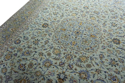 Backside of handmade 2000s Kashan rug showing knot structure and weave density